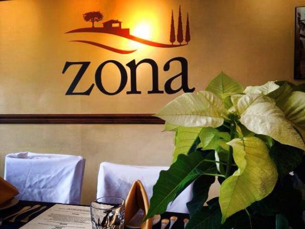 Zona logo behind table